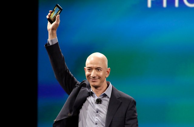 Amazon CEO Jeff Bezos shows off his company's new smartphone, the Fire Phone, in Seattle, Washington