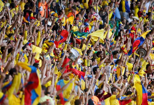 Colombian fans celebrate their team's third goal against Greece during the 2014 World Cup Group C soccer match at the Mineirao stadium in Belo Horizonte