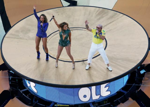 Claudia Leitte, Jennifer Lopez and Pitbull perform during the 2014 World Cup opening ceremony at the Corinthians arena in Sao Paulo