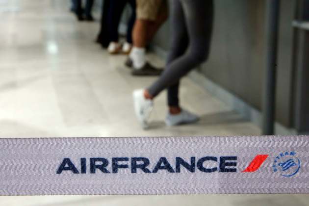 Passengers wait at check-in counters on the first day of an Air France one-week strike at Nice International airport