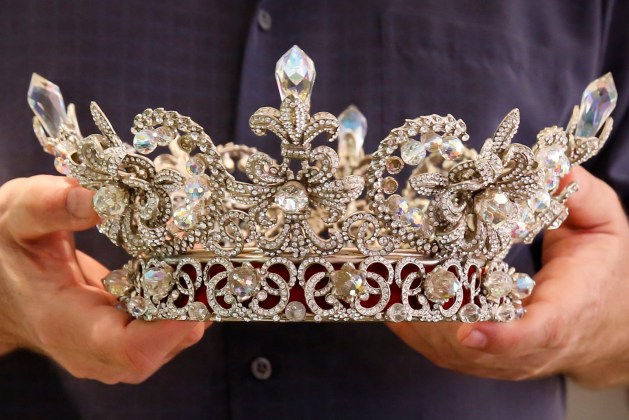 Jeweller Wittels holds a crown designed by him and used in several Venezuelan beauty pageants at his store in Caracas