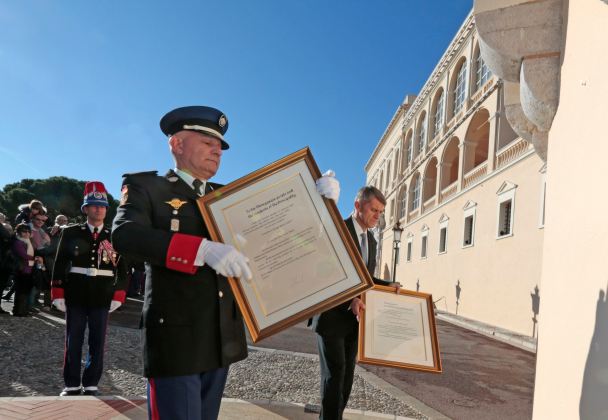 Colonel Luc Fringant and Colonel Laurent Soler walk from Monaco's Palace with the official declaration of Prince Albert II announcing the birth of twins of the Prince and Princess Charlene