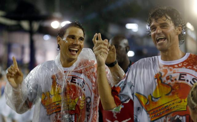 Former tennis player Gustavo Kuerten of Brazil and tennis player Rafael Nadal of Spain attend the annual carnival parade in Rio de Janeiro's Sambadromeennis player Rafael Nadal of Spain attends the annual carnival parade in Rio de Janeiro's Sambadrome,