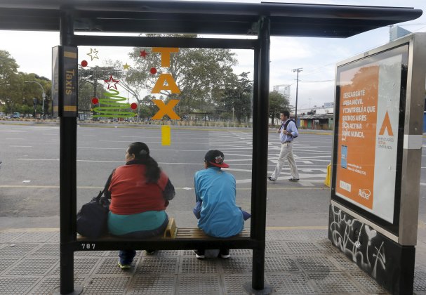 People wait for public transport during a one-day nationwide strike in Buenos Aires