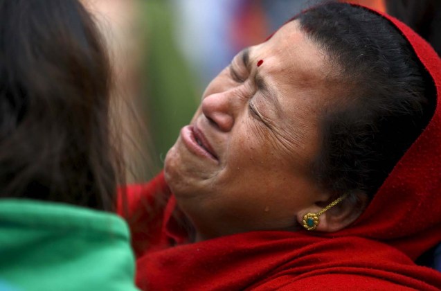 Woman mourns the death of a family member a day after an earthquake in Bhaktapur