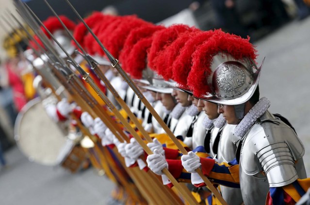 New recruits of the Vatican's elite Swiss Guard stand at attention during the swearing-in ceremony at the Vatican