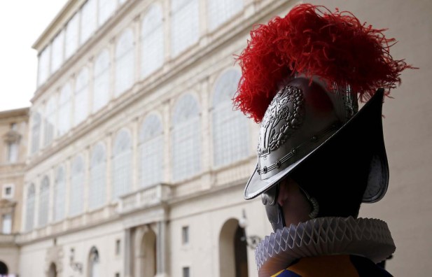 A new recruit of the Vatican's elite Swiss Guard stands at attention during the swearing-in ceremony at the Vatican