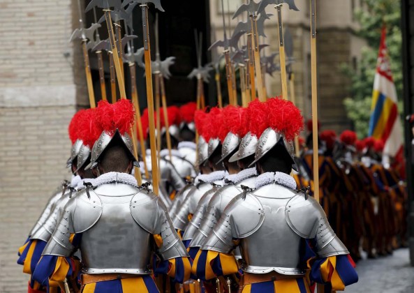 New recruits of the Vatican's elite Swiss Guard march during the swearing-in ceremony at the Vatican