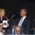 U.S. President Barack Obama shares a laugh with Danish PM Thorning-Schmidt as his wife, U.S. first lady Michelle looks on during a memorial service for late South African President Nelson Mandela in Johannesburg