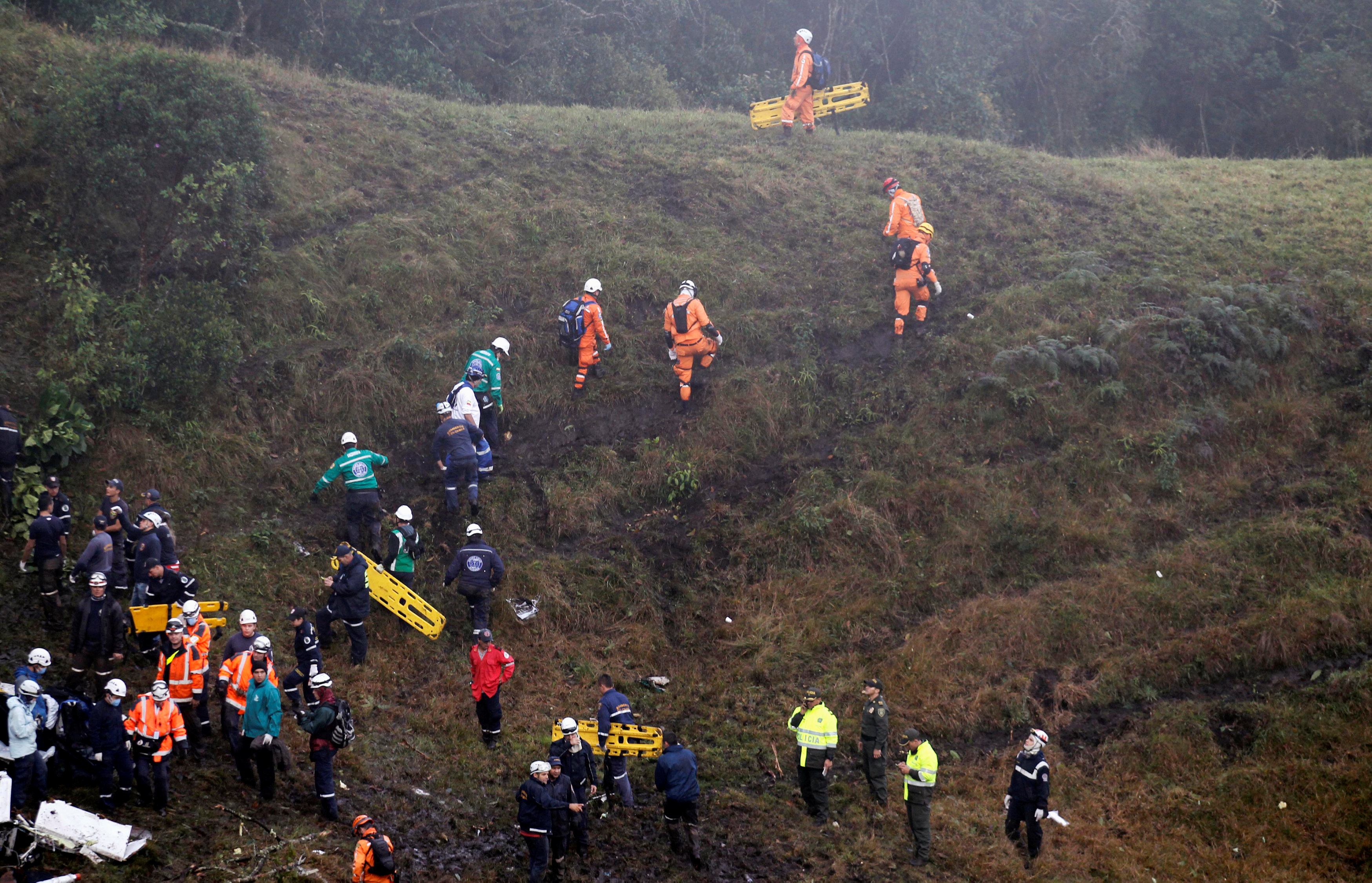 Rescue crew work near the wreckage from a plane that crashed into Colombian jungle with Brazilian soccer team Chapecoense, seen near Medellin, Colombia, November 29, 2016. REUTERS/Fredy Builes