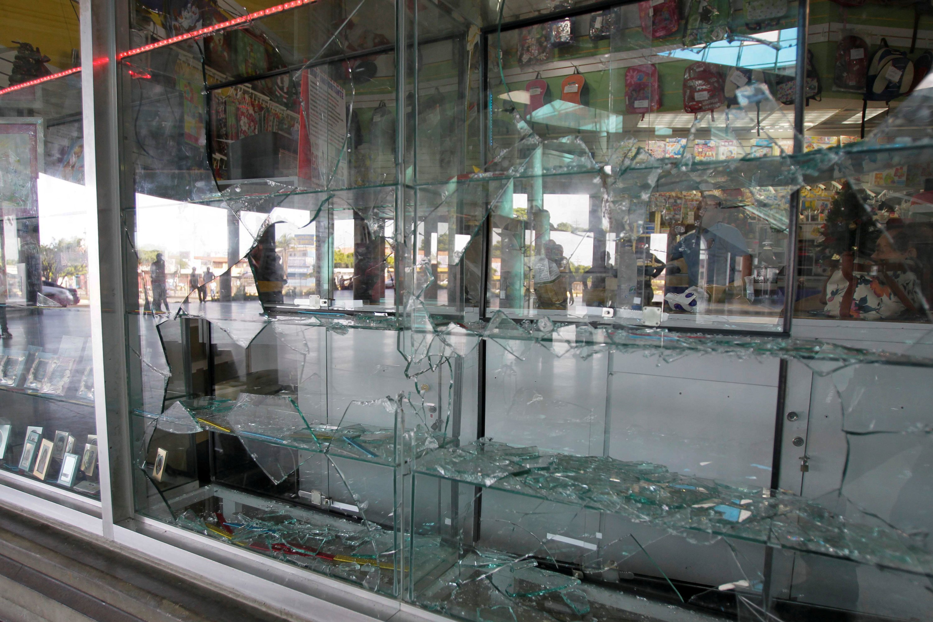 Broken showcases are seen after a shoe shop was looted in Maracaibo