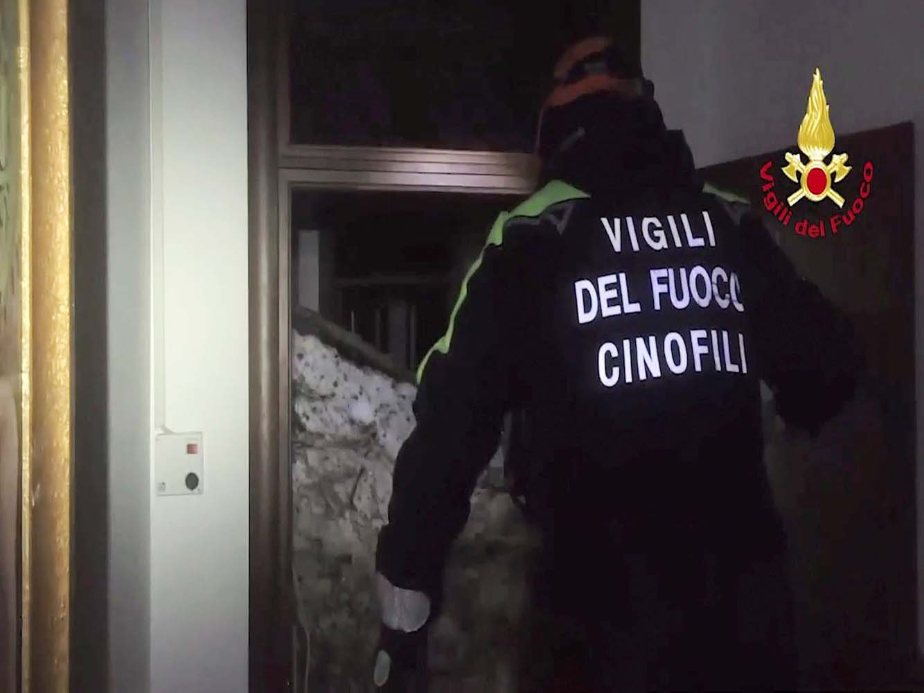 A still image taken from a video shows a firefighter working at Hotel Rigopiano in Farindola, central Italy, after it was hit by an avalanche, January 20, 2017 provided by Italy's Fire Fighters. Vigili del Fuoco/Handout via REUTERS ATTENTION EDITORS - THIS IMAGE WAS PROVIDED BY A THIRD PARTY. EDITORIAL USE ONLY.