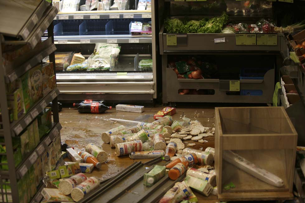 This picture taken on February 11, 2017 shows the inside of a vandalised Franprix supermarket during a protest in Bobigny, a district of northeast Paris, to denounce police brutality after a black man was allegedly sodomised with a baton during an arrest while in their custody in Paris. A 22-year-old black youth worker named as Theo, a talented footballer with no criminal record, required surgery after his arrest on February 2, 2017 when he claims a police officer sodomized him with his baton. One officer has been charged with rape and three others with assault over the incident in the tough northeastern suburb of Aulnay-sous-Bois which has revived past controversies over alleged police brutality. / AFP PHOTO / GEOFFROY VAN DER HASSELT