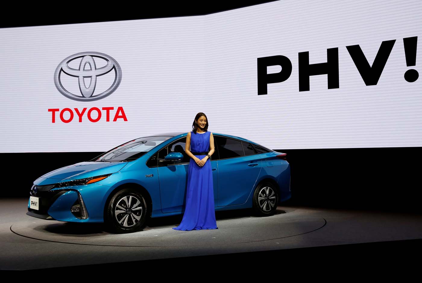 Japanese actress Satomi Ishihara poses next to Toyota Motor Corp.' Prius PHV Plug-in-Hybrid vehicle, also known as Prius Prime in the U.S., during an event to mark the launch of the car in Japan, in Tokyo, Japan February 15, 2017. REUTERS/Issei Kato