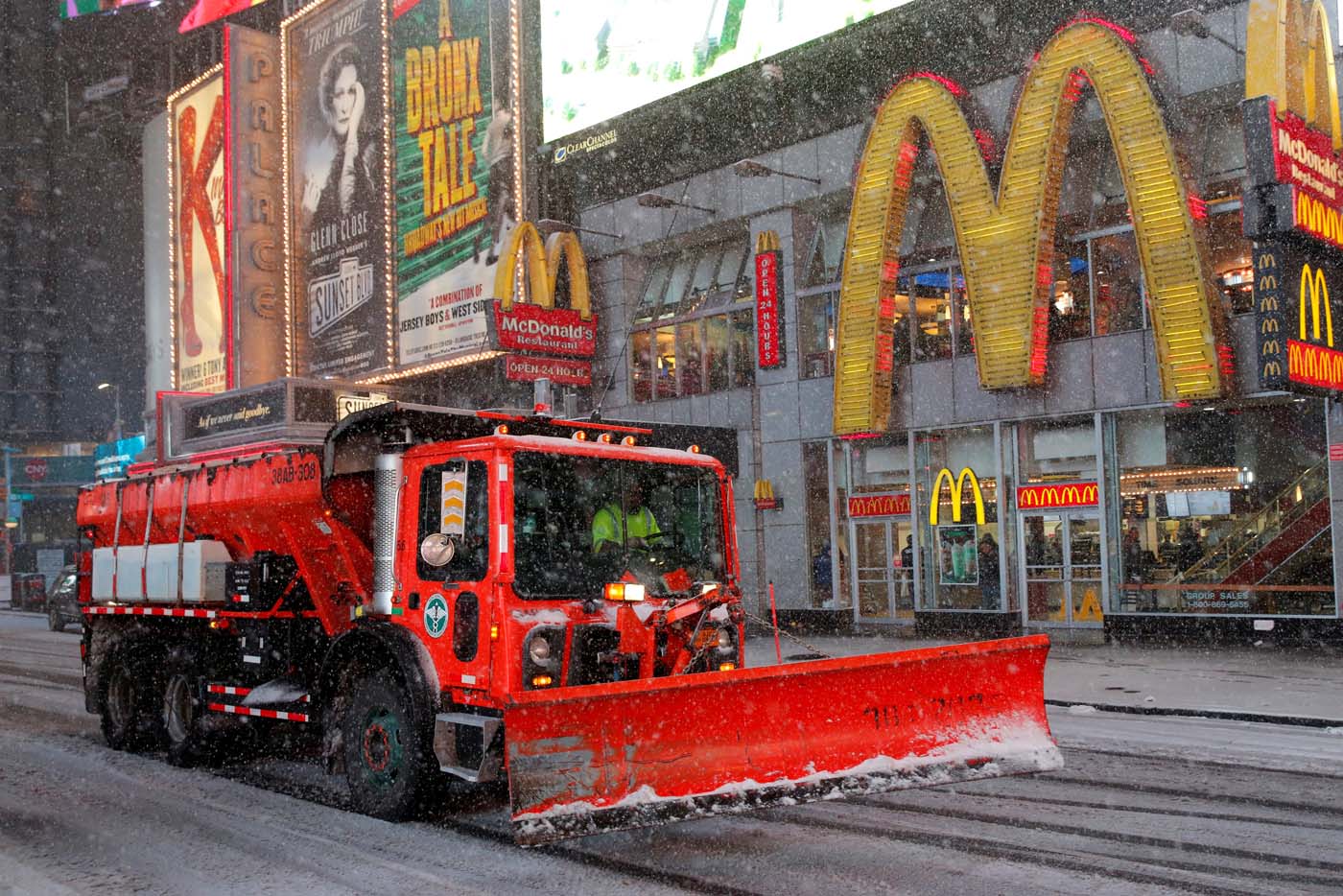 A snow plow drives through Times Square as snow falls in Manhattan, New York, U.S., March 14, 2017. REUTERS/Andrew Kelly