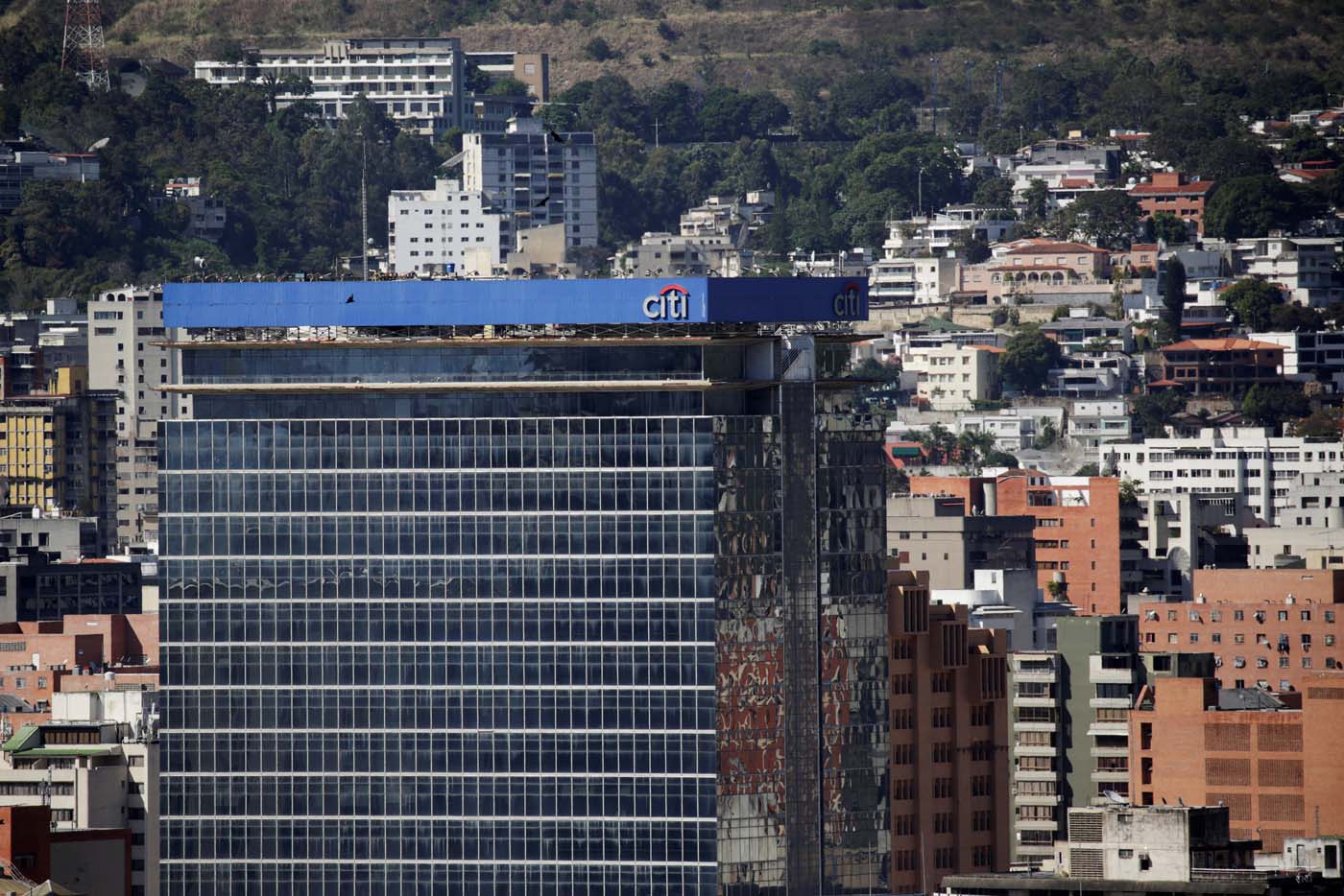 The logo of Citi is seen atop a building in Caracas, Venezuela February 8, 2017. Picture taken February 8, 2017. REUTERS/Marco Bello To match Exclusive VENEZUELA-BANKS/