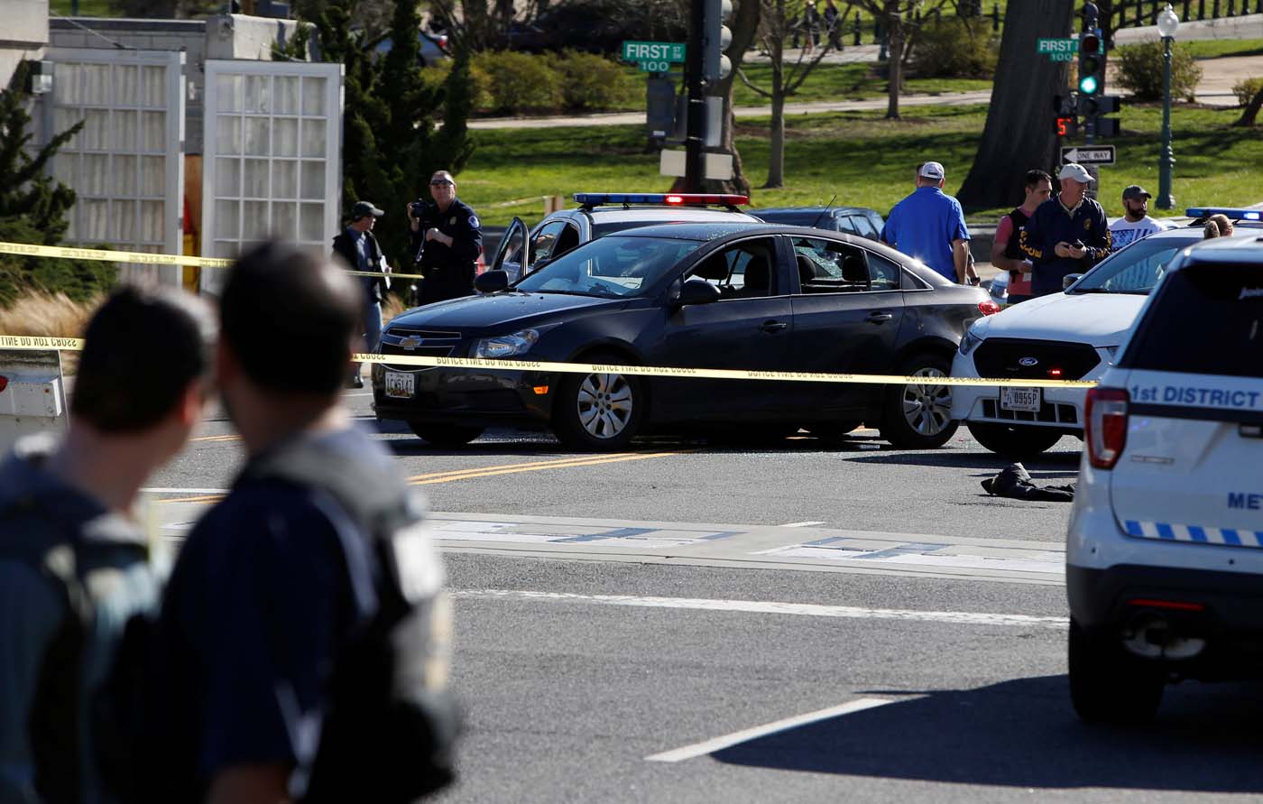 Capitol Hill police inspect a car whose driver struck a Capitol Police cruiser and then tried to run over officers, near the U.S. Capitol in Washington, U.S., March 29, 2017. REUTERS/Joshua Roberts