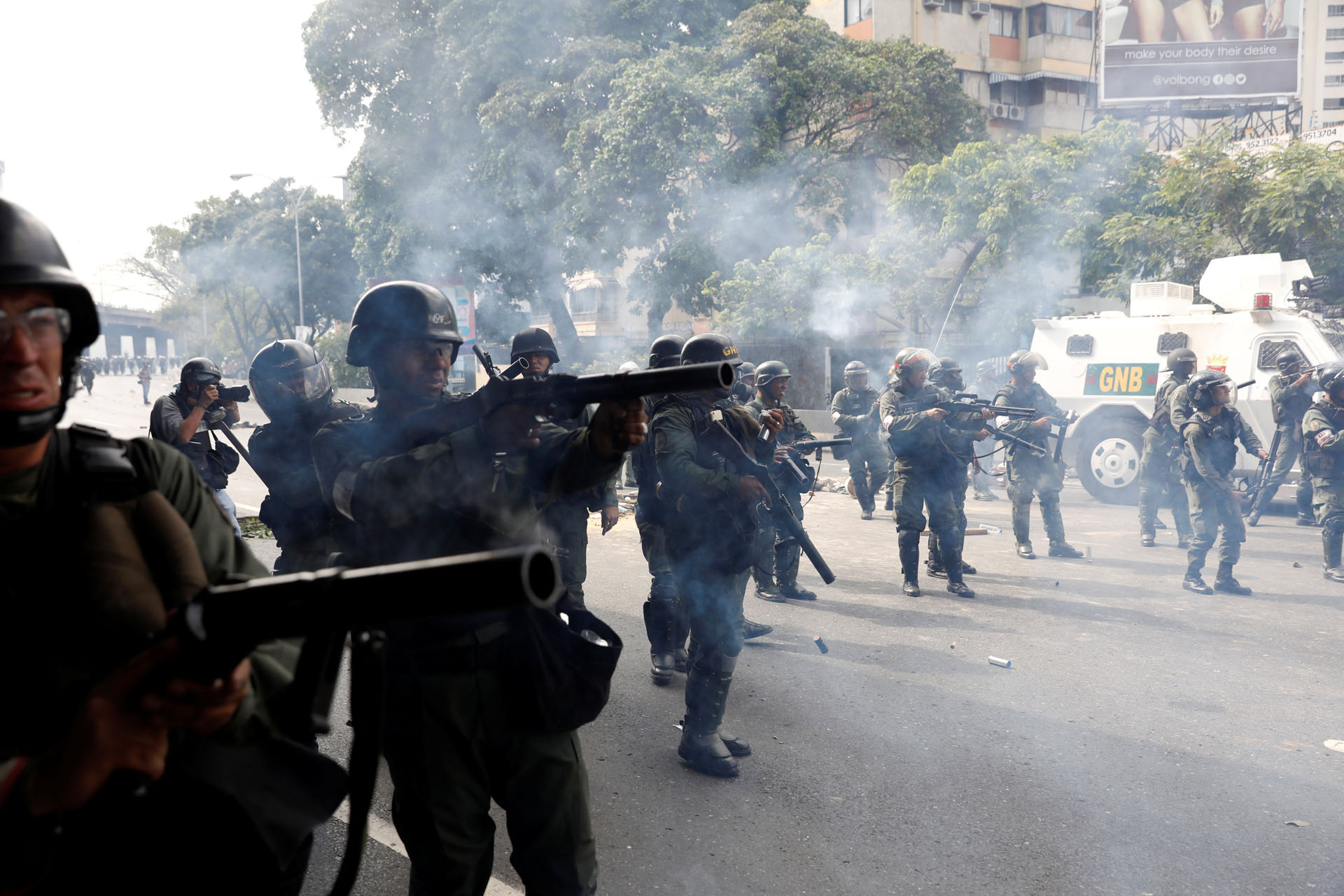 Venezuelan national guard fire tear gas towards demonstrators during an opposition rally in Caracas, Venezuela, April 6, 2017. REUTERS/Carlos Garcia Rawlins