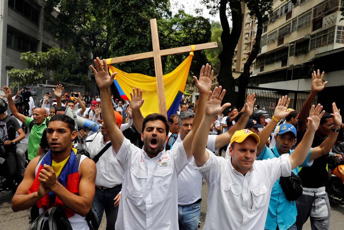 Demonstrators take part in a rally to honour victims of violence during a protest against Venezuela's President Nicolas Maduro's government in Caracas, Venezuela, April 22, 2017. REUTERS/Carlos Garcia Rawlins