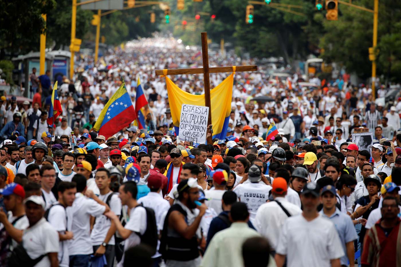 Demonstrators take part in a rally to honour victims of violence during a protest against Venezuela's President Nicolas Maduro's government in Caracas, Venezuela, April 22, 2017. REUTERS/Carlos Garcia Rawlins