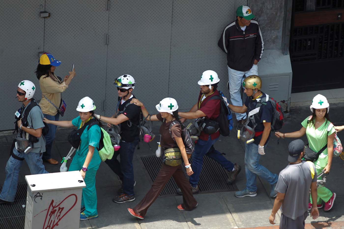 Volunteers walk looking for injured demonstrators during a rally against Venezuela's President Nicolas Maduro in Caracas, Venezuela April 20, 2017. Picture taken April 20, 2017. REUTERS/Christian Veron