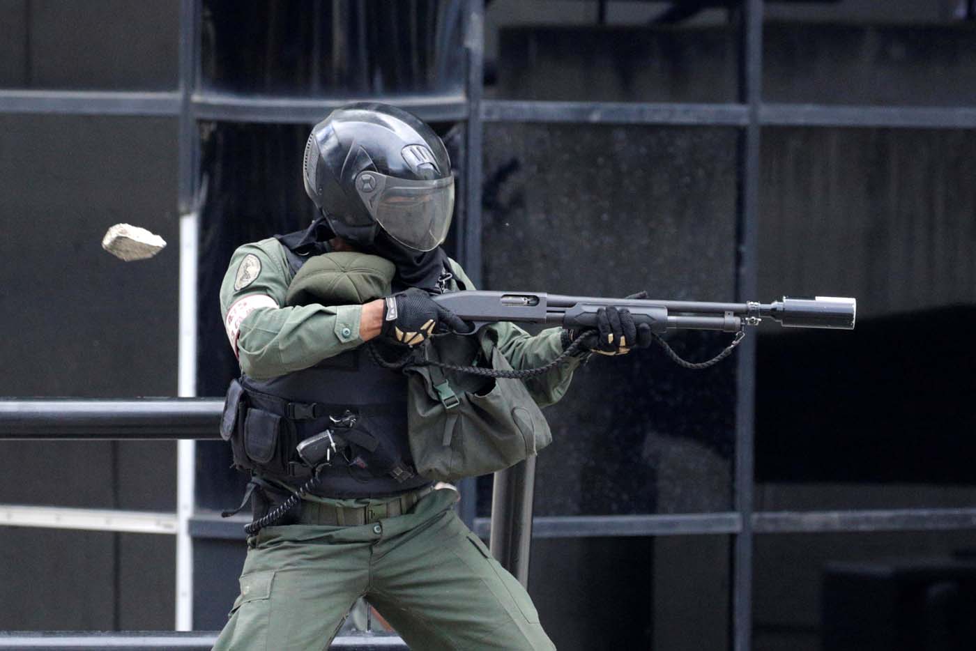 Riot police fire tear gas while clashing with opposition supporters rallying against President Nicolas Maduro in Caracas, Venezuela May 3, 2017. REUTERS/Marco Bello