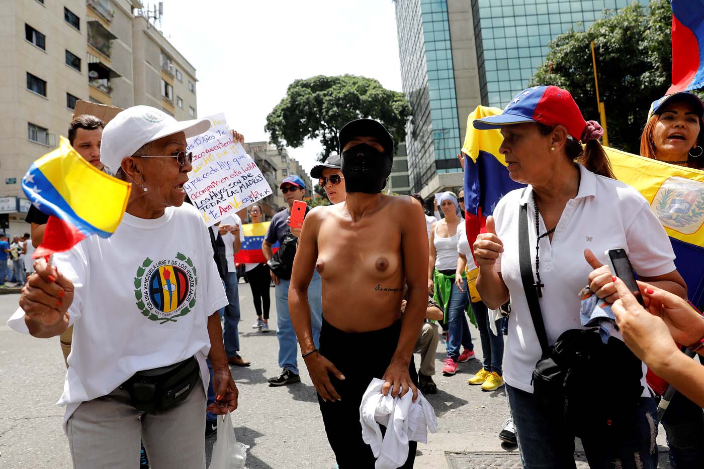 A woman wearing a mask attends a women's march to protest against President Nicolas Maduro's government in Caracas, Venezuela, May 6, 2017. REUTERS/Carlos Garcia Rawlins TEMPLATE OUT
