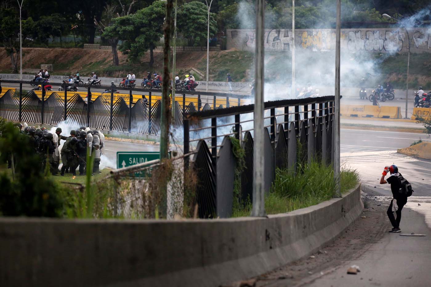 Military police take position at an air base as opposition supporters clash with them while rallying against President Nicolas Maduro in Caracas, Venezuela, May 8, 2017. REUTERS/Carlos Garcia Rawlins