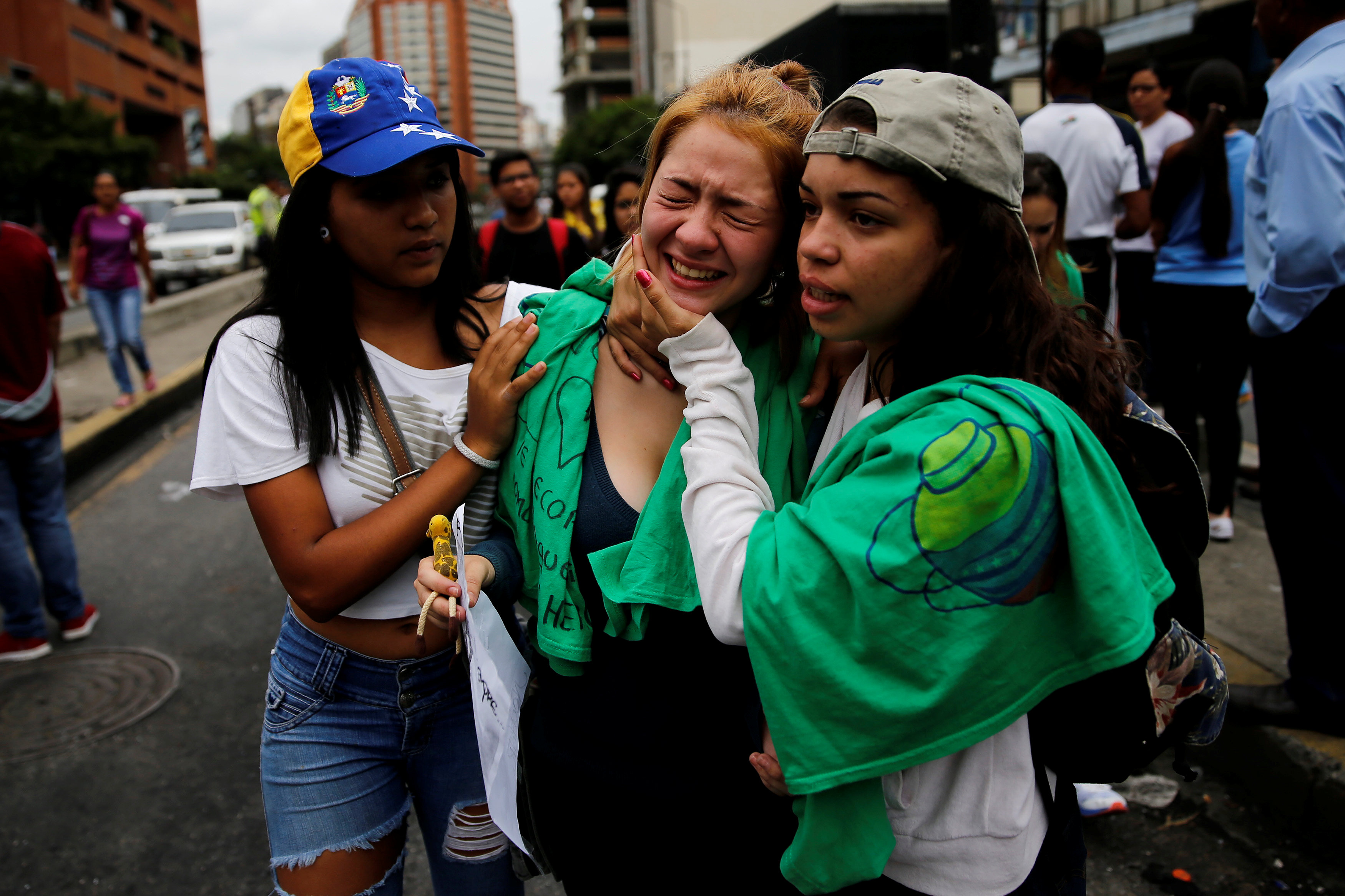 A woman reacts at the place where 17-year-old demonstrator Neomar Lander died during riots at a rally against Venezuelan President Nicolas Maduro's government in Caracas, Venezuela, June 8, 2017. REUTERS/Ivan Alvarado