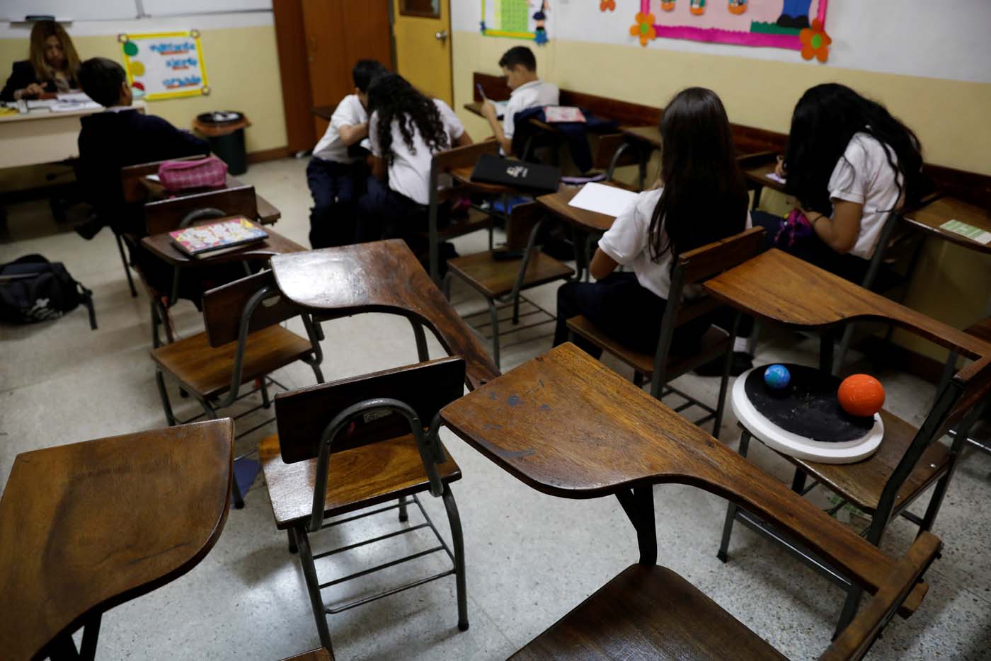 Empty desks are seen in the classroom of a school on a day of protests in Caracas, Venezuela June 14, 2017. Picture taken June 14, 2017. REUTERS/Carlos Garcia Rawlins