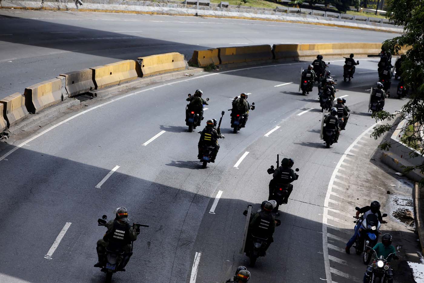 Members of security forces ride their motorcycles during a rally against Venezuelan President Nicolas Maduro's government in Caracas, Venezuela, July 6, 2017. REUTERS/Andres Martinez Casares