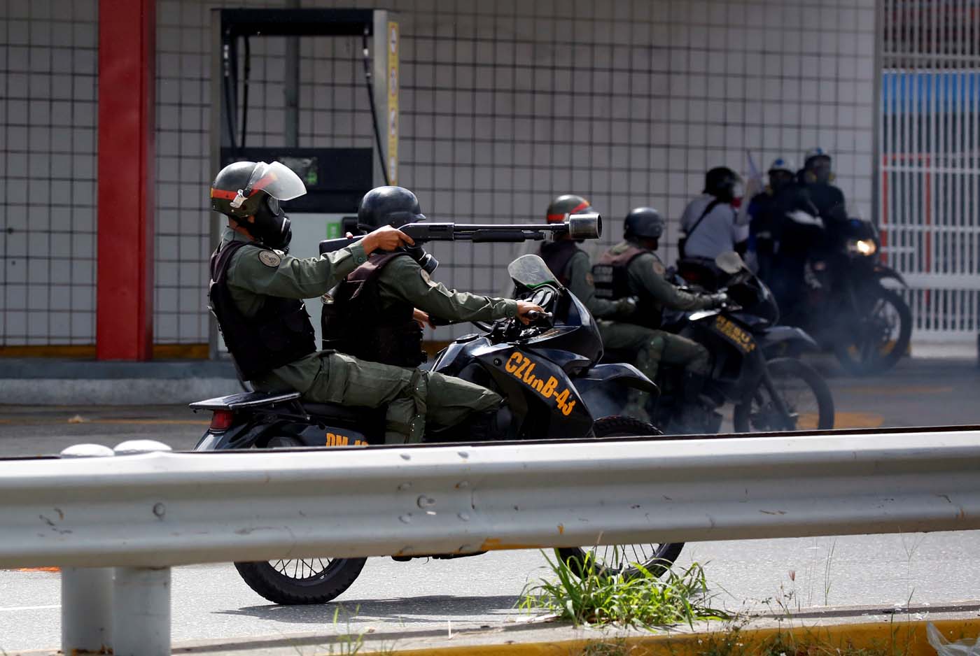Members of security forces ride their motorcycles during a rally against Venezuelan President Nicolas Maduro's government in Caracas, Venezuela, July 6, 2017. REUTERS/Carlos Garcia Rawlins