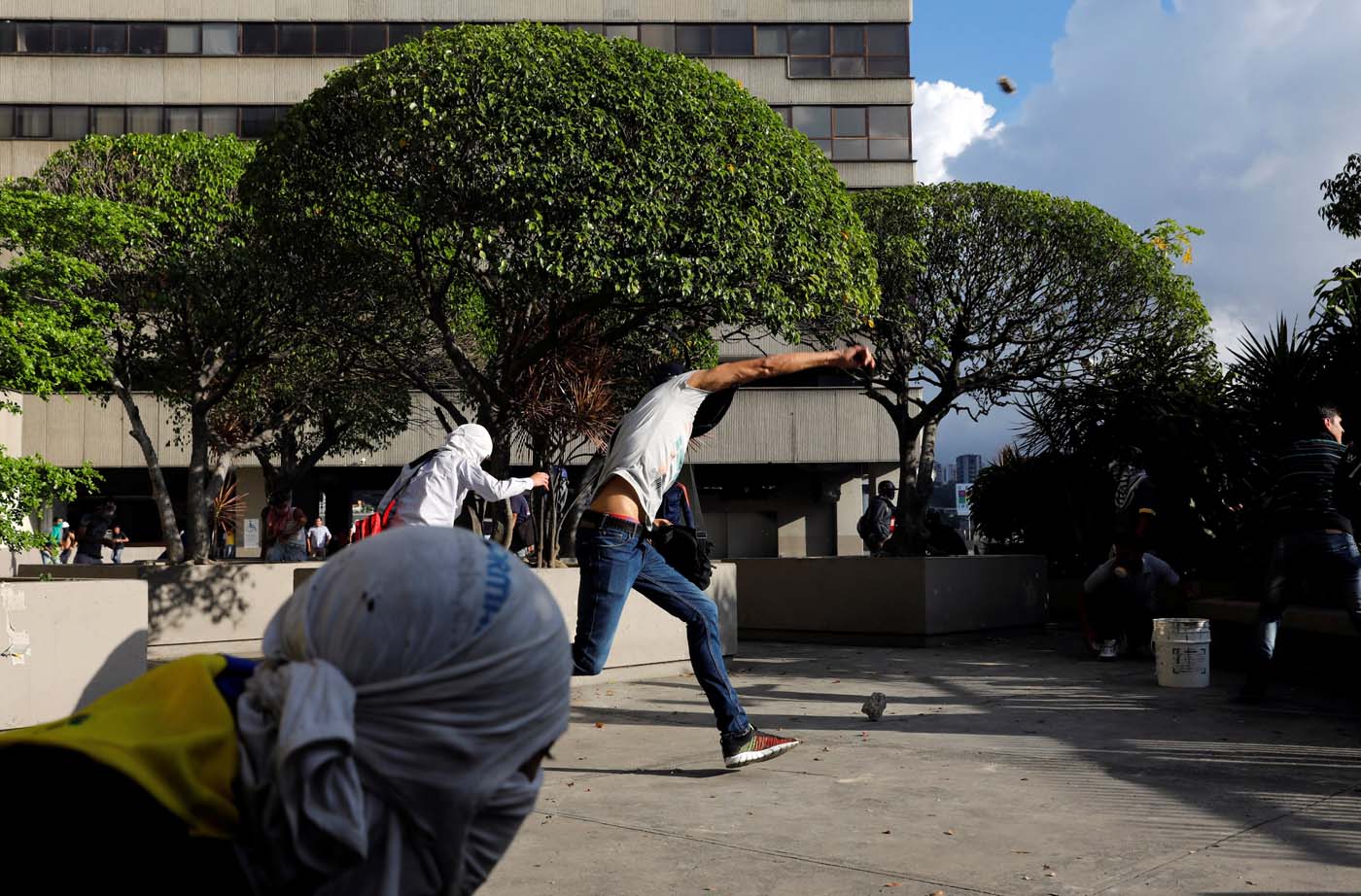 Demonstrators hurl stones during clashes with security forces at a rally against Venezuelan President Nicolas Maduro's government in Caracas, Venezuela, July 6, 2017. REUTERS/Andres Martinez Casares