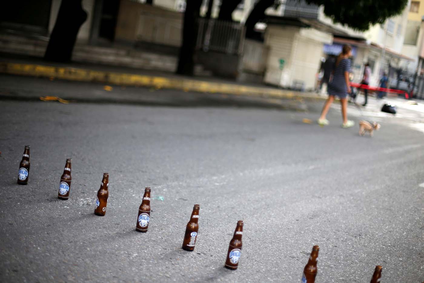 Beer bottles are seen placed on the street during a strike called to protest against Venezuelan President Nicolas Maduro's government in Caracas, Venezuela, July 20, 2017. REUTERS/Andres Martinez Casares