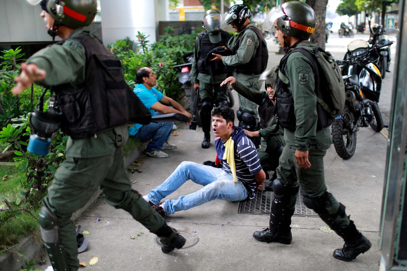 A demonstrator is detained at a rally during a strike called to protest against Venezuelan President Nicolas Maduro's government in Caracas, Venezuela July 27, 2017 . REUTERS/Marco Bello