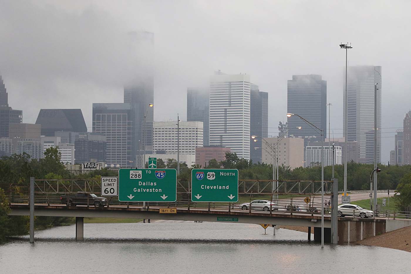 Downtown Houston and submerged highways are seen August 27, 2017 as the city battles with tropical storm Harvey and resulting floods. / AFP PHOTO / Thomas B. Shea