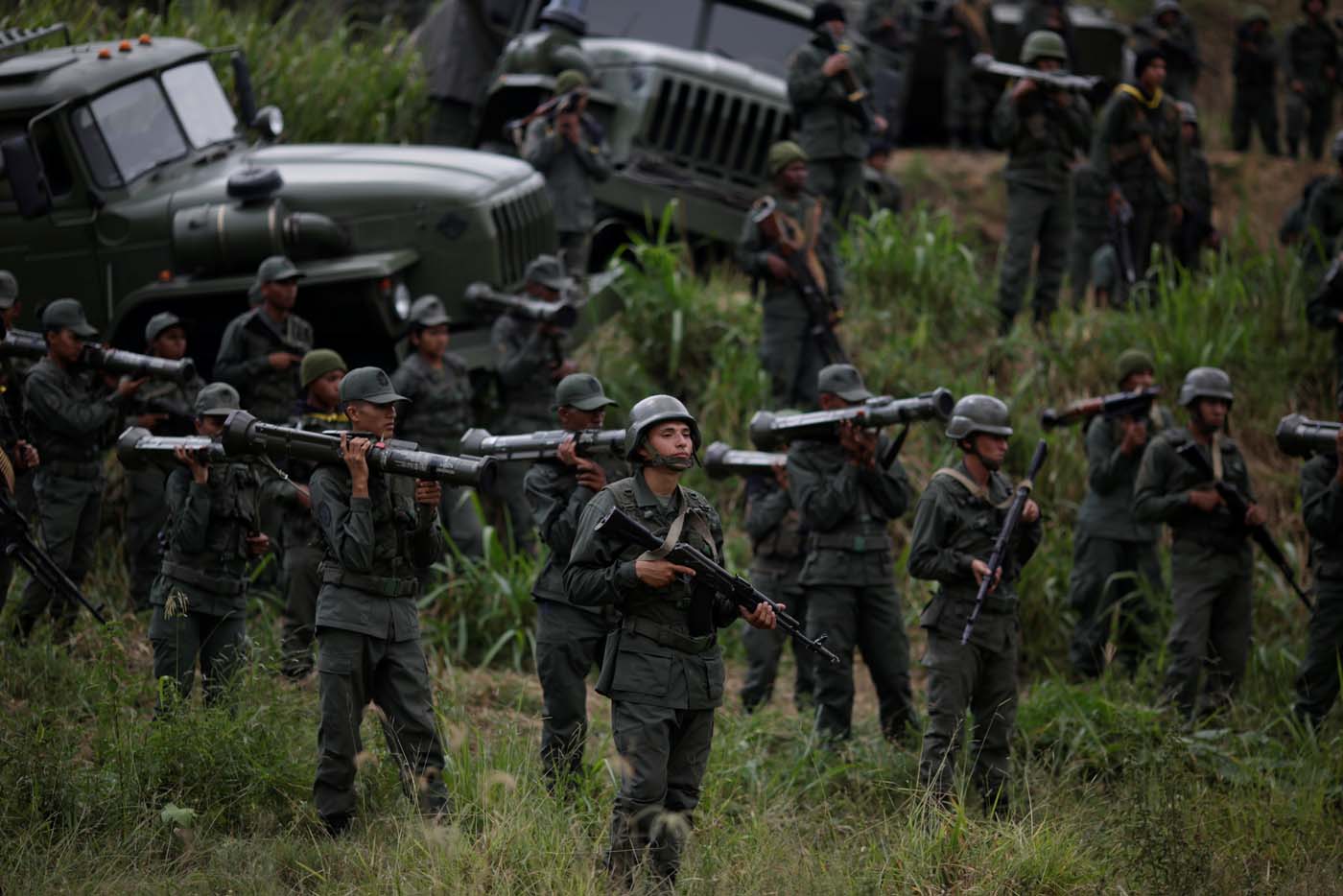 Members of the National Bolivarian Armed Forces attend a news conference by Admiral-in-Chief Remigio Ceballos, Strategic Operational Commander of the Bolivarian National Armed Forces, during military exercises at Fuerte Tiuna Military Base in Caracas, Venezuela August 25, 2017. REUTERS/Marco Bello