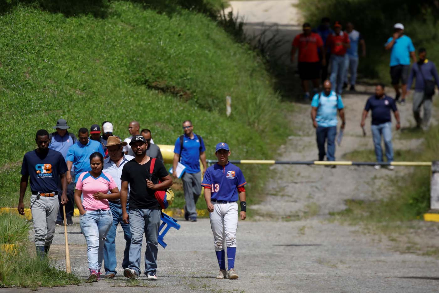 People attend to a baseball showcase in Caracas, Venezuela August 22, 2017. Picture taken August 22, 2017. REUTERS/Carlos Garcia Rawlins