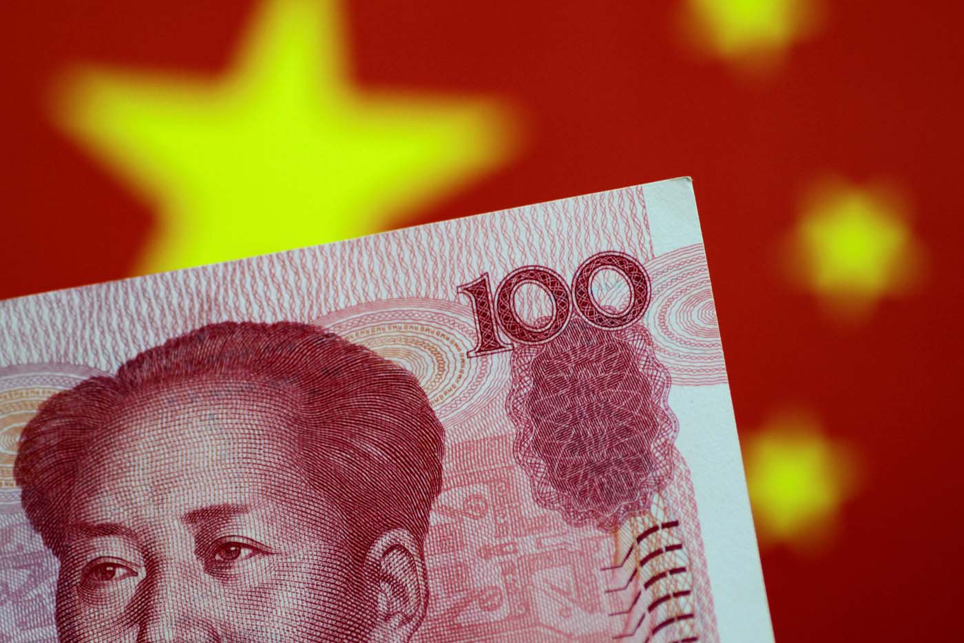 FILE PHOTO: A China yuan note is seen in this illustration photo May 31, 2017. REUTERS/Thomas White/Illustration/File Photo