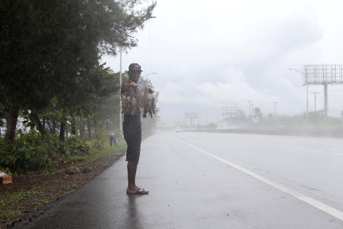 A man sell lobsters on the road before the arrival of the Hurricane Maria in Punta Cana, Dominican Republic, September 20, 2017. REUTERS/Ricardo Rojas