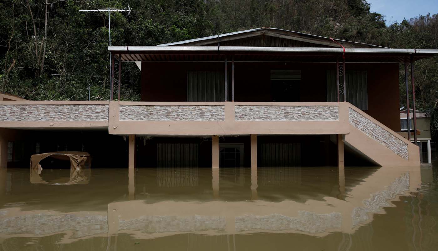 A house submerged by flood waters is seen close to the dam of the Guajataca lake after the area was hit by Hurricane Maria in Guajataca, Puerto Rico September 23, 2017. REUTERS/Carlos Garcia Rawlins