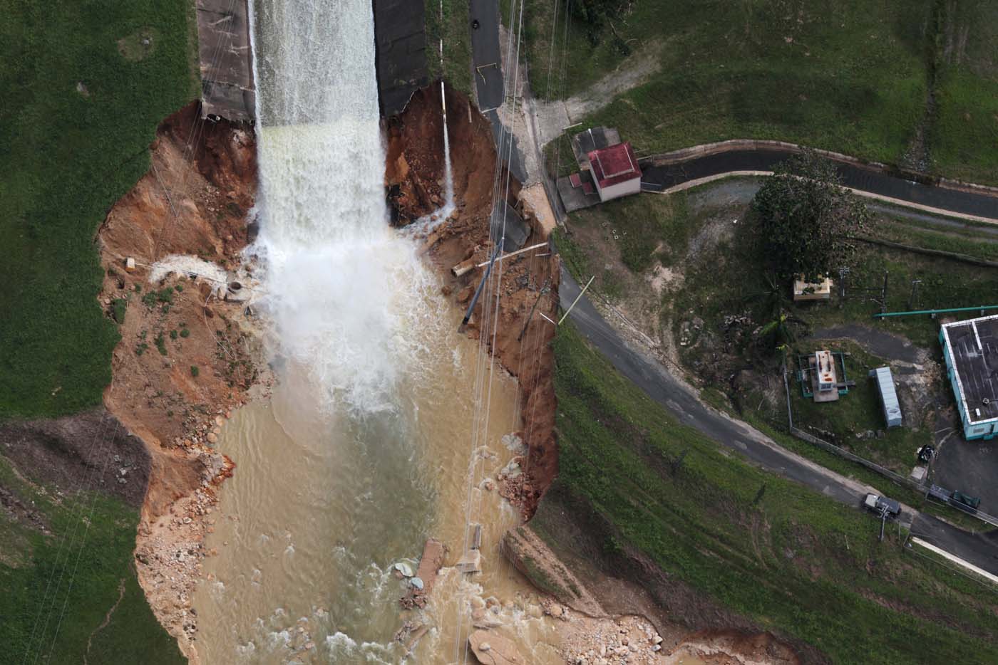 An aerial view shows the damage to the Guajataca dam in the aftermath of Hurricane Maria, in Quebradillas, Puerto Rico September 23, 2017. REUTERS/Alvin Baez TPX IMAGES OF THE DAY