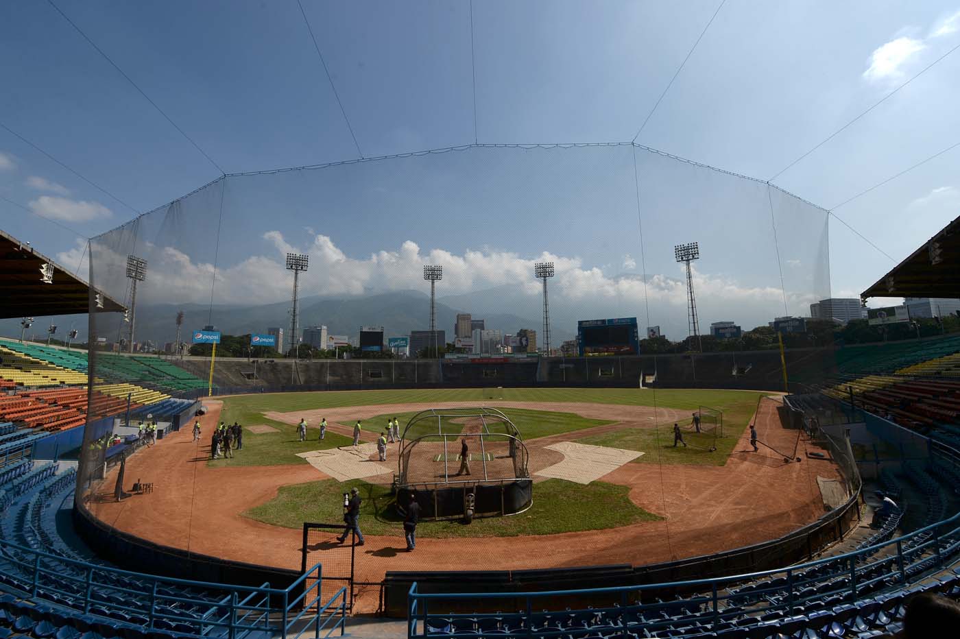 Players of the Venezuelan baseball team Leones del Caracas attend a training session at the Universitario stadium in Caracas, on September 18, 2017. While baseball is Venezuela's national sport, some fans are angry that the government, given the severity of the economic crisis and the political tension, will spend nearly ten million dollars on organizing the upcoming Winter League rather than on imports of food and medicine. / AFP PHOTO / FEDERICO PARRA