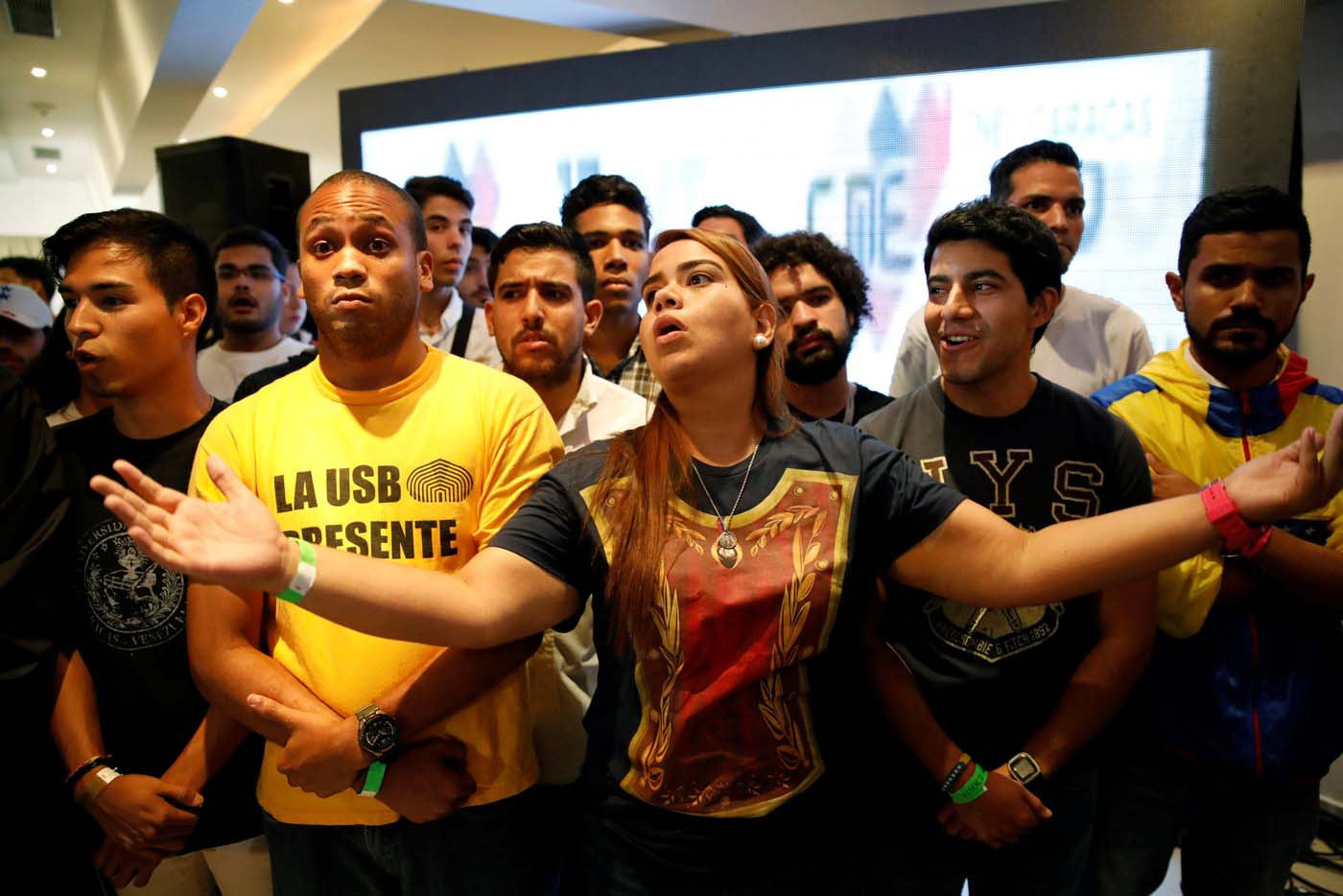 Opposition supporters react while listening to the results of the nationwide election for new governors, at the campaign headquarters of the Venezuelan coalition of opposition parties (MUD) in Caracas, Venezuela October 15, 2017. REUTERS/Carlos Garcia Rawlins