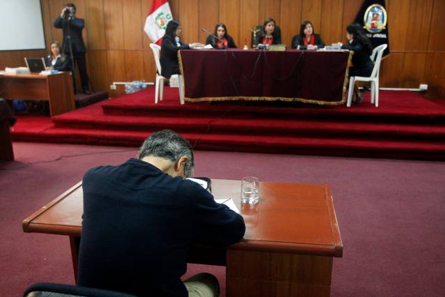 Peru's former President Alberto Fujimori sits in court as he attends a trial related to the use of the media during his tenure as president, in Lima