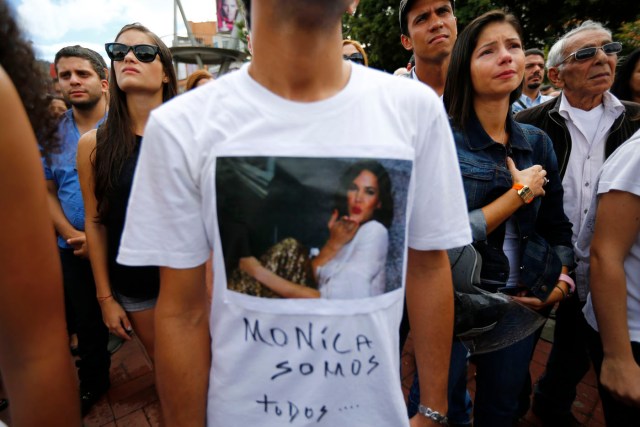 Fans of former Miss Venezuela Monica Spear react while taking part in a demonstration against violence in Caracas