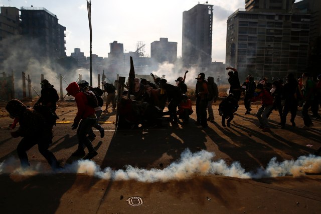 Anti-government protesters clash with police at Altamira square in Caracas