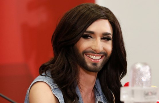 Austria's Conchita Wurst smiles as she addresses a news conference in Vienna