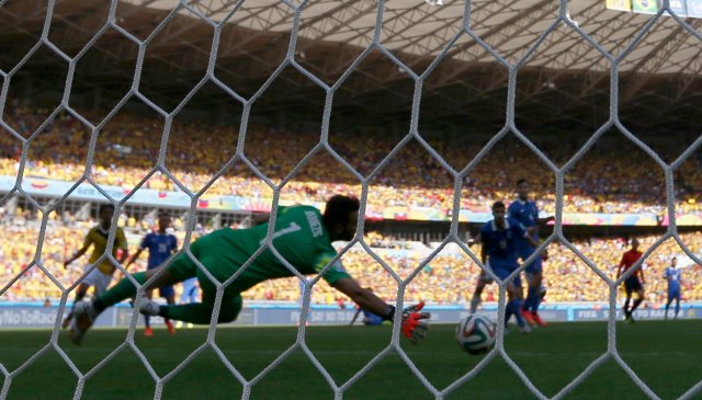 Greece's goalkeeper Orestis Karnezis fails to save the ball during 2014 World Cup soccer match between Colombia and Greece in Belo Horizonte
