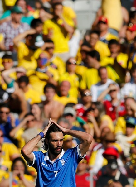 Greece's Giorgios Samaras react after Colombia's Gutierrez scored during 2014 World Cup soccer match in Belo Horizonte